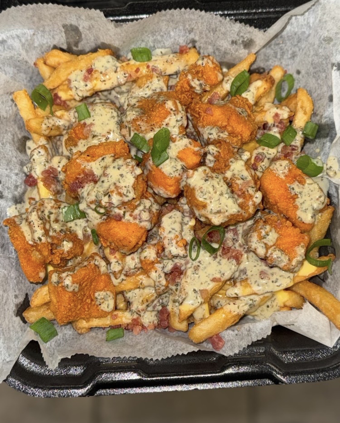 Buffalo chicken loaded fries with ranch and bacon